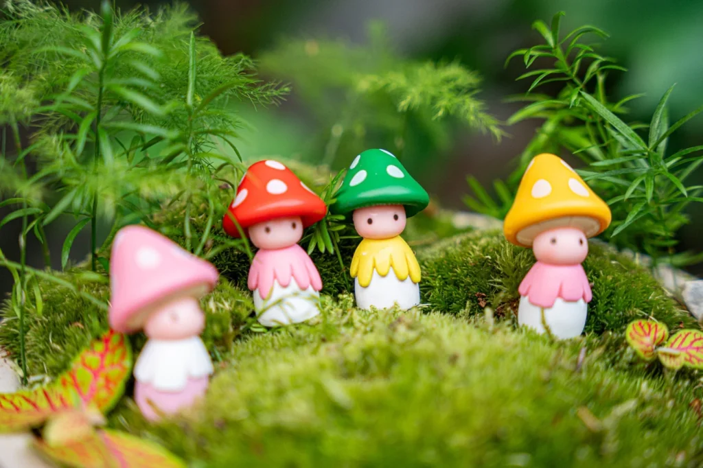 Tiny toadds figurines in a terrarium decoration