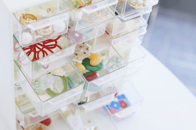 glass storage box containing small figurines